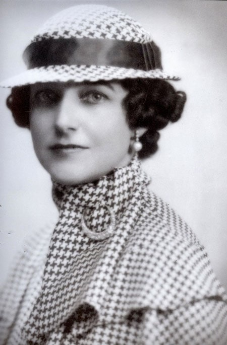  An Interior Decorator from the 1930s, Dorothy Draper, wears a houndstooth-patterned suit with a matching hat.